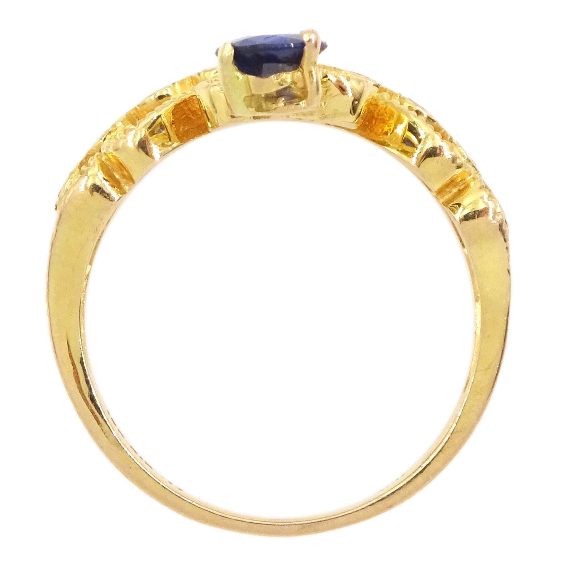 18ct gold pear cut sapphire and nine stone round brilliant cut diamond openwork ring, stamped 750