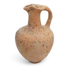 A group of eight ancient terracotta vessels - Near East and Eastern Mediterranean c.2nd millennium BC-1st century AD, comprising a Nabataean red terracotta ‘eggshell’ bowl (c.1st century BC-1st century AD) finely wheel-made with a thin-walled hemispherical form and pale red slip; a Near Eastern black-burnished spouted vessel (c.1800-1600 BC) of globular form with single handle and short spout; large Roman or Late Iron Age single-handled jug (c.1st century BC-1st century AD) wheel-made with a wide neck and ovoid body; together with five further vessels including shallow dishes, squat jars and a ribbed bottle, likely of Middle Bronze Age Levantine and Roman provincial types.
Provenance: By the vendor’s repute, acquired/collected in the Middle East (Dead Sea area/Syria) in the 1960s