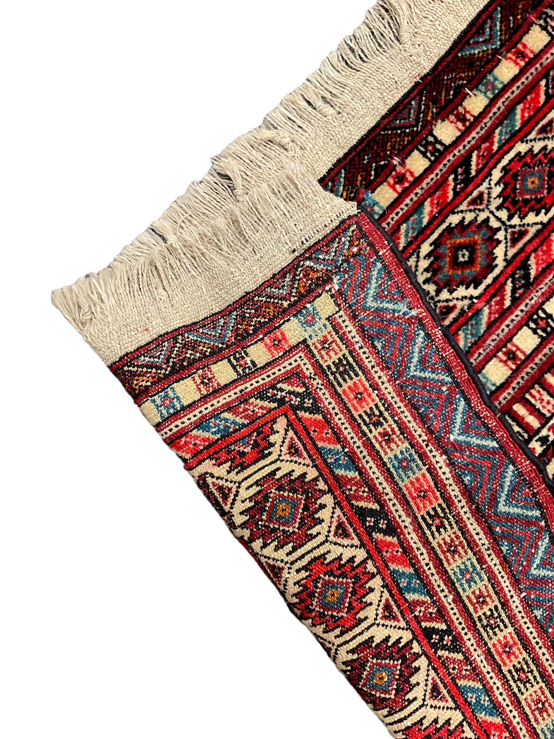 North East Persian Turkoman rug, ivory ground field decorated with repeating Gul motifs, multi-band border decorated with geometric patterns and motifs