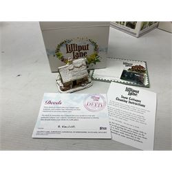 Five Lilliput Lane Illuminated Cottages, comprising Christmas is Coming, with box and deed, Christmas at Mol's, with box and deed, Christmas in Canterbury, with box and deed, Christmas Lights at Sweet Delights and The Three Kings, with box and deeds, together with twelve other Lilliput lanes, to include The First Noel, with box and deed, Winters Moonlight, Yuletide treats, with box and deed etc (17)