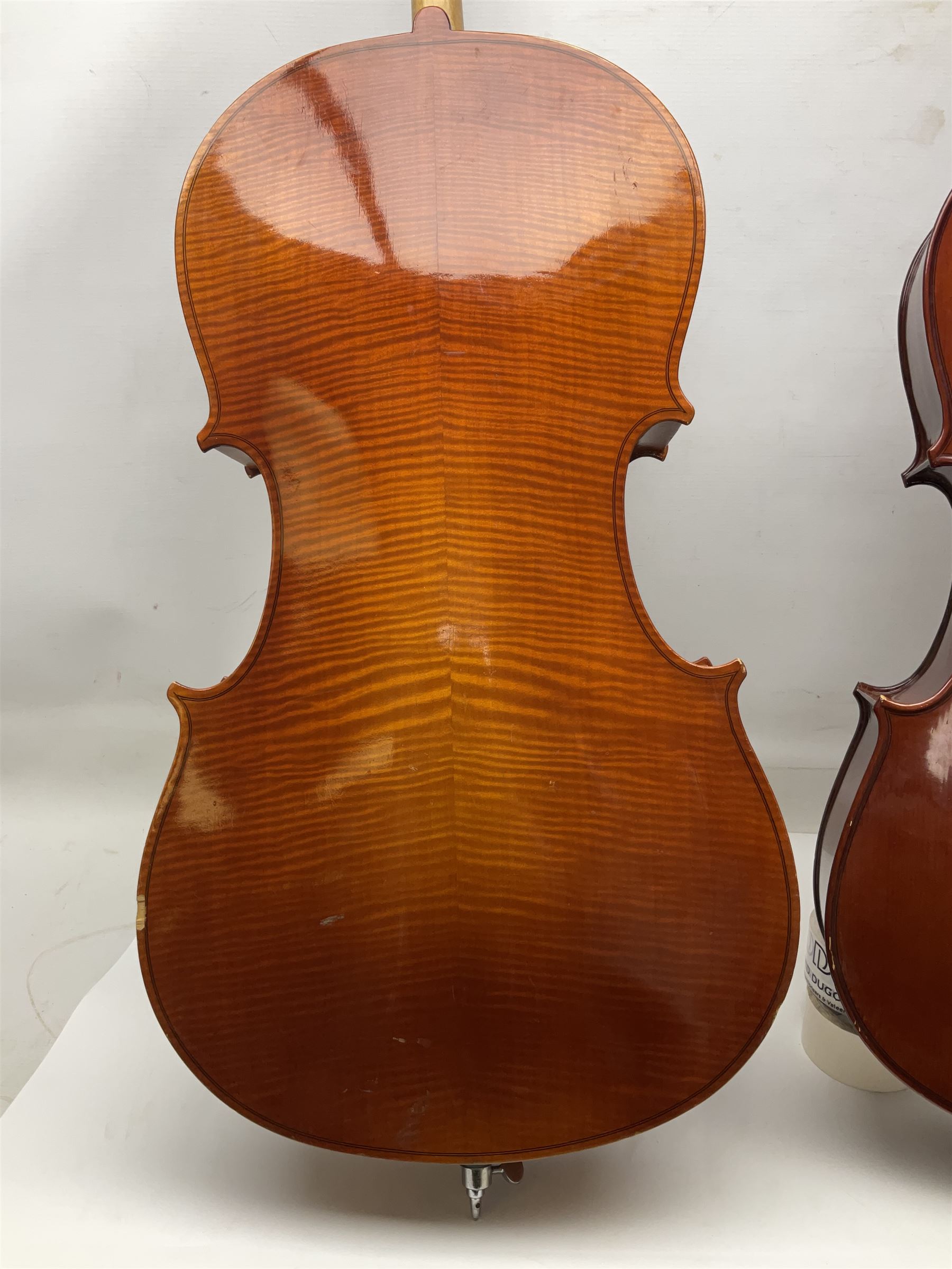 Modern Hungarian half-size cello with 69cm two-piece maple back and ribs and spruce top L114cm overall; and Stentor half size cello bearing label 'The Stentor Student II'; each in soft carrying case (2)