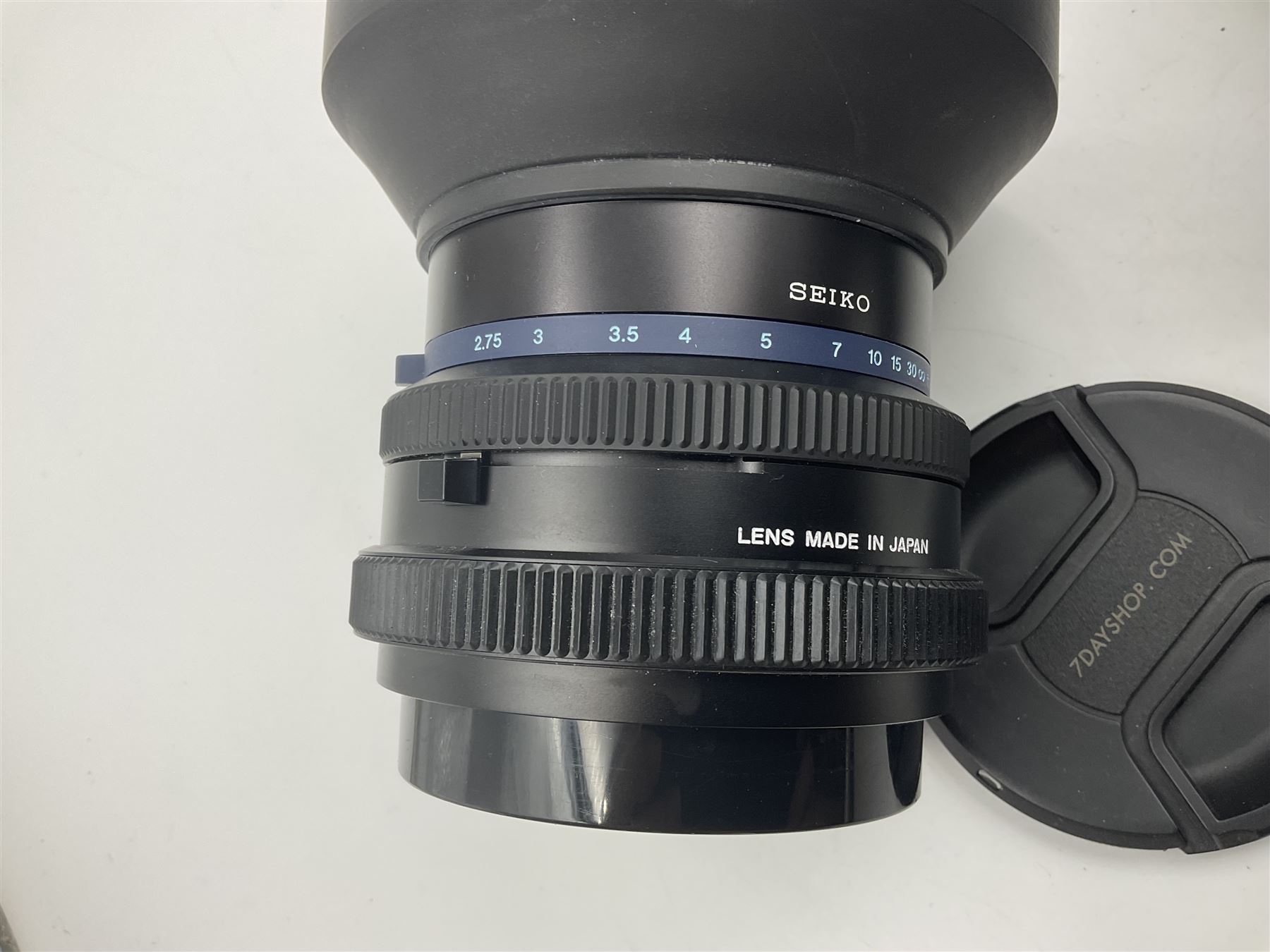 Seiko 'Mamiya Macro M 1:4.5 f=140mm M/L-A' lens serial no 003593 and Seiko 'Mamiya-Sekor Z f=110mm 1:2.8W' lens, serial no 56560