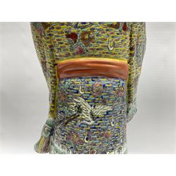 Chinese Republic Period porcelain figure, modelled as Shoulao, wearing elaborately enamelled robes decorated with peaches and flower heads, with impressed mark beneath, H55cm