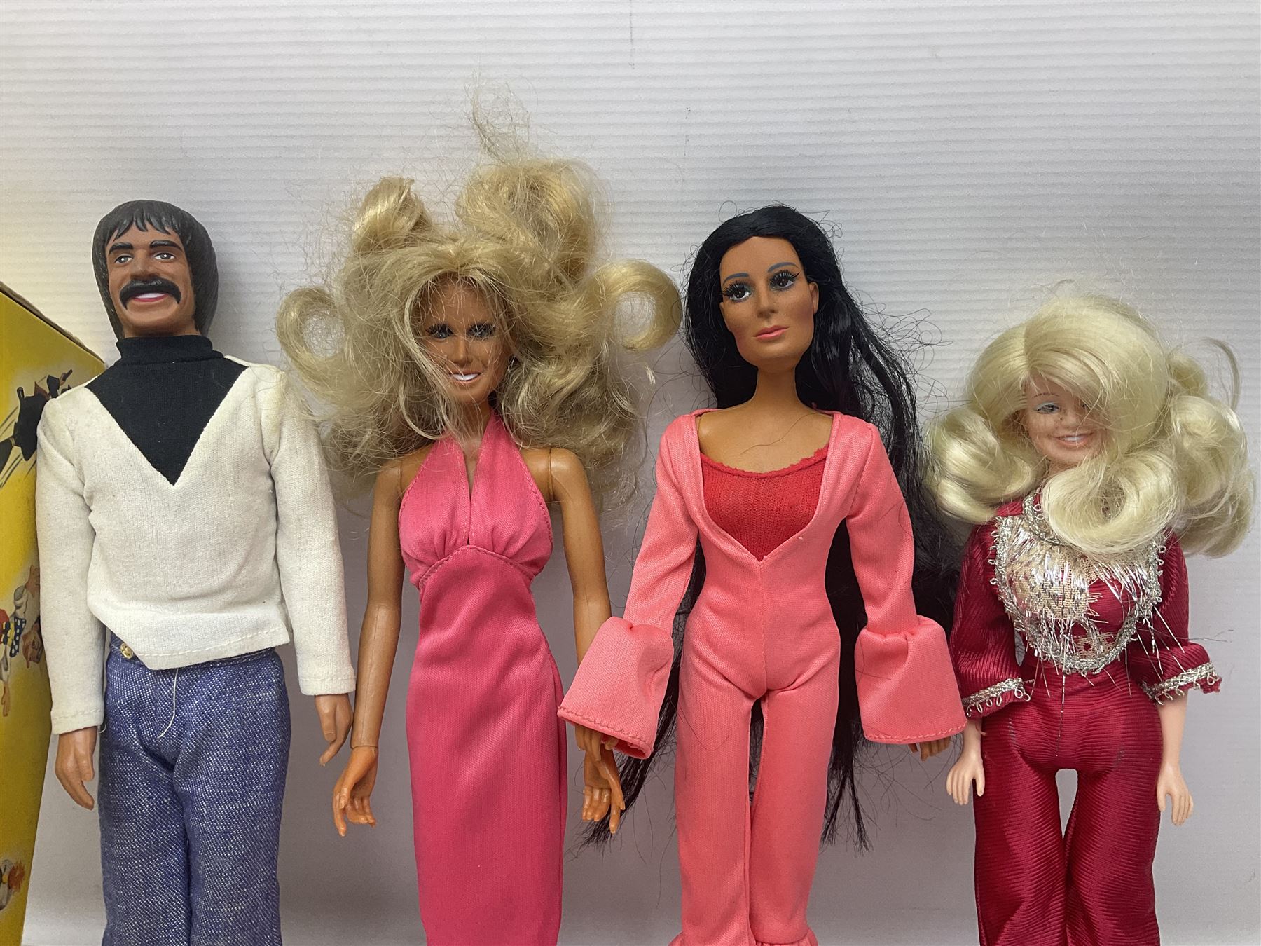 Pelham Puppet - Tyrolean Girl in yellow box; three 'A' Team action figures; clockwork plastic Mickey Mouse figure; and seven various fashion dolls (12)