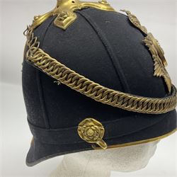 Late Victorian North Staffordshire Regiment Officer's Home Service Blue Cloth Helmet, having incorrect other ranks gilt metal Queen's crown helmet plate to the front with later leather backing, removable spike to the top on a shaped cruciform base with rosette fittings, rosette side bosses, brass trim to the front peak, and leather and velvet backed chin scales, with leather sweat band, the interior with makers stamp for Hawkes & Co 14 Piccadilly London