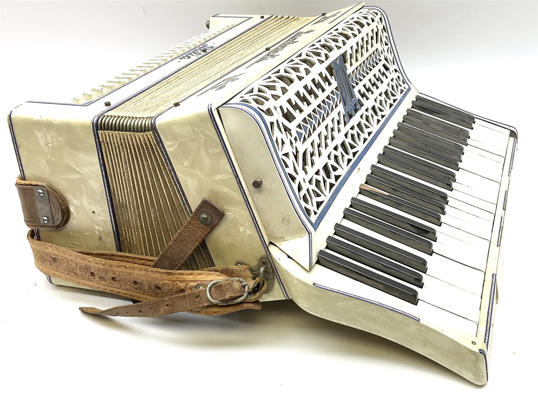 Italian Lambardi piano accordion in ivory coloured pearline case with jewelled decoration, twenty keys and one-hundred and twenty buttons L 37cm