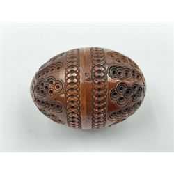 Three 19th century coquilla nut pomanders or flea catchers, two of egg shaped form and the third of barrel from with carved and pierced decoration and screw threaded join, largest H8cm
