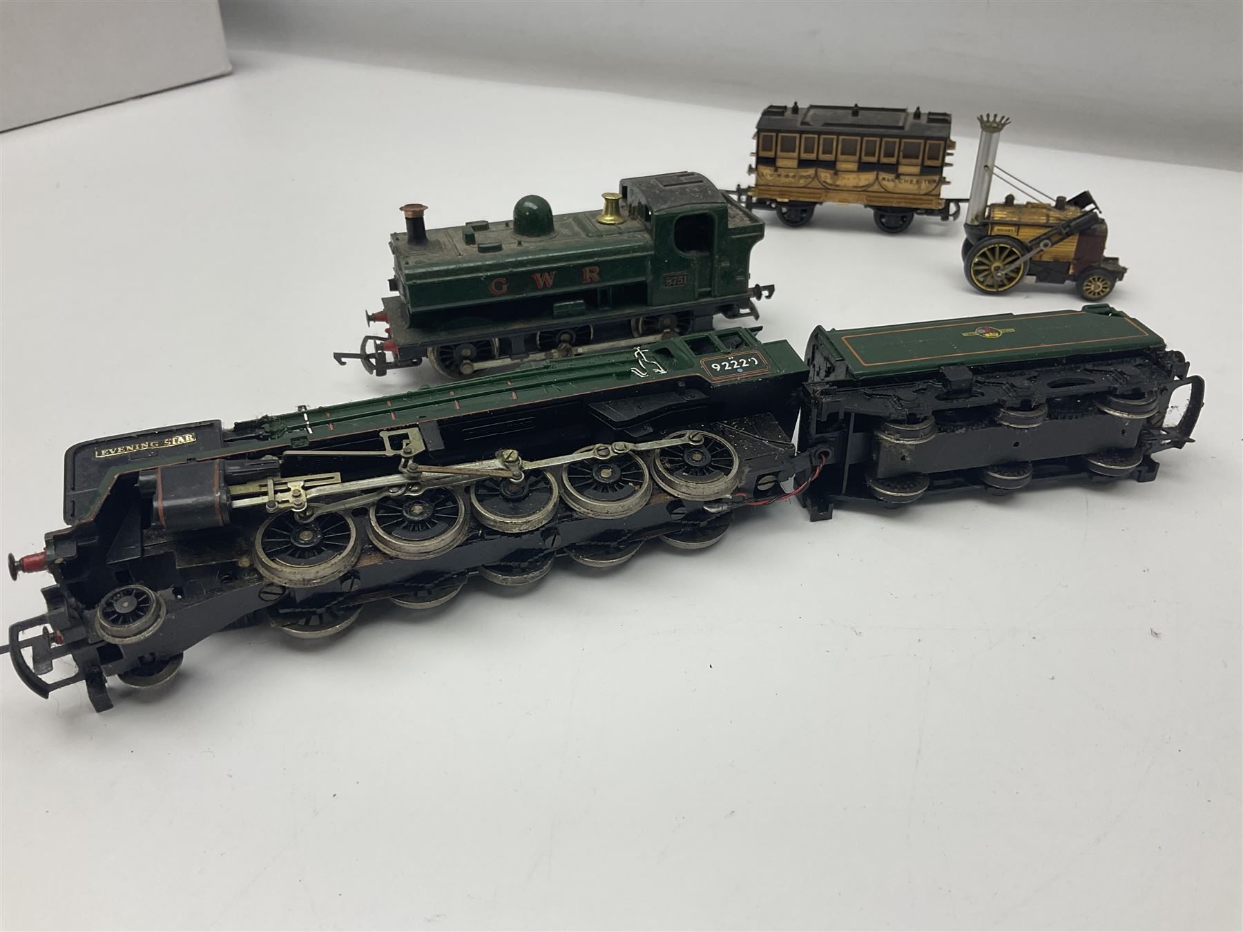 Hornby/Tri-ang '00' gauge - six locomotives - Class 9F 2-10-0 'Evening Star' No.92220; Class A3 4-6-2 (no name or number); Dean Single 4-2-2 'Lord of the Isles' No.3046; Princess Class 4-6-2 'The Princess Royal' No.46200; Class 57XX Pannier 0-6-0 tank No.8751; and Stephenson's Rocket with one passenger coach; all unboxed (6)