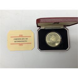 Eight cased silver coins, including Republic of Panama twenty Balboas proof coin, Jamaica 1974 ten dollars, United Kingdom Queen Elizabeth II 1993 proof crown etc