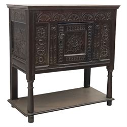 19th century oak cupboard cabinet, the moulded rectangular top above a deeply carved front...