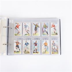 Collection of Edwardian and later Football related trading and cigarette cards, including forty-nine of fifty 1906 Ogden's Football Club Colours, 1922 PALS Footall series, ninety of one hundred 1925 Gallaher Famous Footballers, complete set of forty-four 1926 Ogden's Captains of Association Football Clubs and Colours, complete set of fifty 1927 Players Football Caricatures by MAC,  complete set of fifty 1927 Players Football Caricatures by RIP,  complete set of fifty 1930 Players Association Cup Winners, complete set of 50 1933 Ogdens AFC Nicknames etc, housed in brown cigarette card album