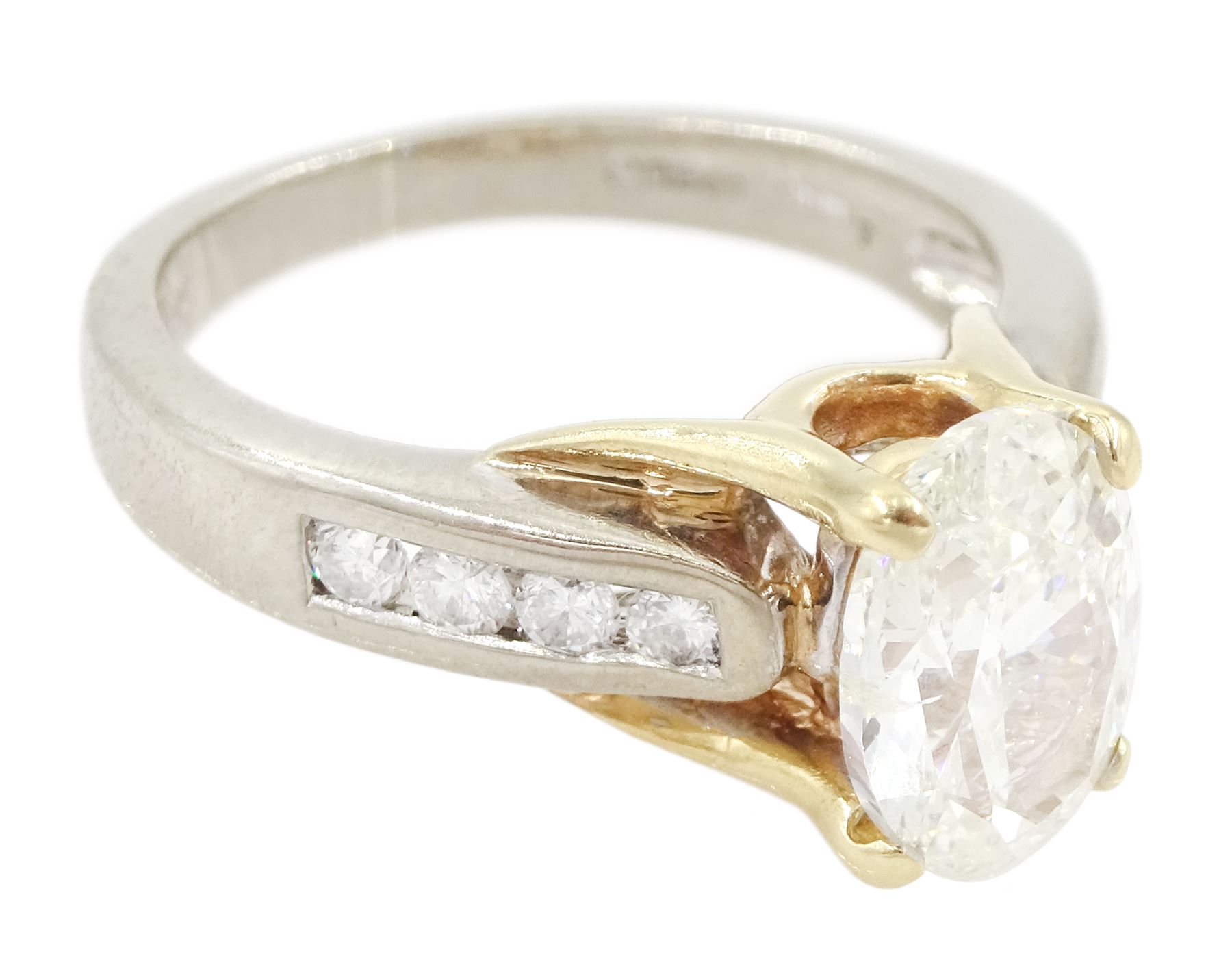 Gold single stone oval cut diamond ring, with round brilliant cut diamond shoulders, hallmarked 14ct, principal diamond approx 1.55 carat, total diamond weight approx 1.75 carat