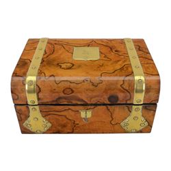 19th century walnut and brass bound games compendium box, painted to enhance the grain, of rectangular form, the hinged opening cover with rounded sides, central brass cartouche with engraved lion crest, and brass riveted straps, opening to reveal a red leather and blue silk lined compartmented interior, with fold-down games board, and lift-out tray containing playing cards, ebony turned dice towers, white and red stained bone draughts, and chess pieces, ivory dice, and ivory and ebony whist markers, and brass bezique board, cribbage board and markers, H15cm W32cm D24cm
This lot has been registered for sale under Section 10 of the APHA Ivory Act