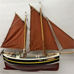 Wooden model of the Peterhead Herring Fishing Boat, Love Divine, PD404. on stand together with Wick Herring Fishing Boat, Galilee WK.1. on stand, L105cm, H64cm