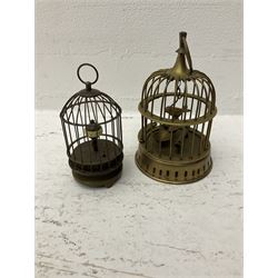 Two brass birdcages, the smaller with winding mechanism to underside, tallest H17.5cm