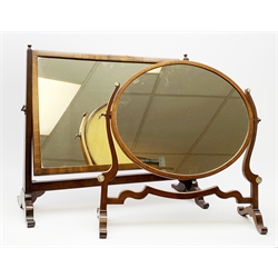 An Edwardian mahogany dressing table mirror, the oval mirror plate in swing frame, upon flared legs linked by stretcher, the frame detailed with turned roundels, H49cm, together with a Victorian mahogany example, H50cm. 
