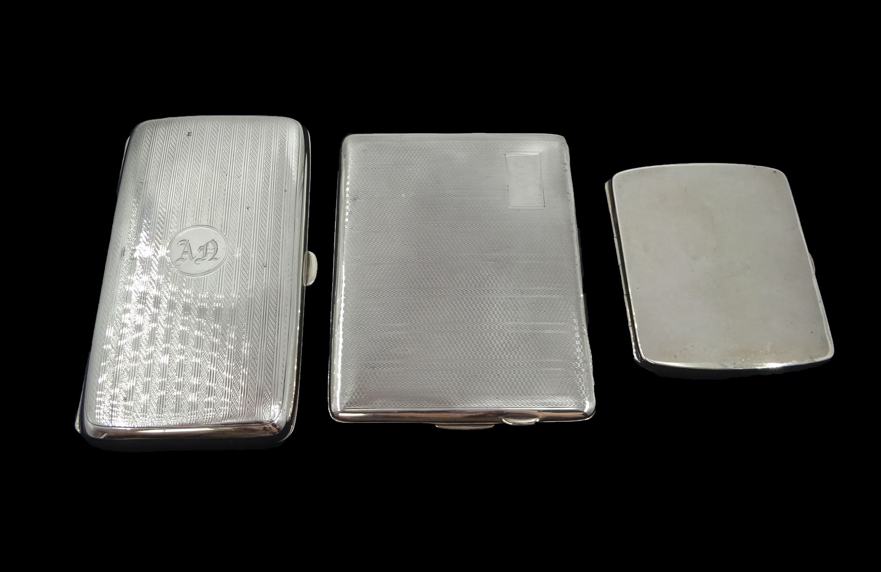 Three silver cigarette cases by Smith & Bartlam, William Neale & Son and James Deakin & Sons, all hallmarked, approx 10.5oz