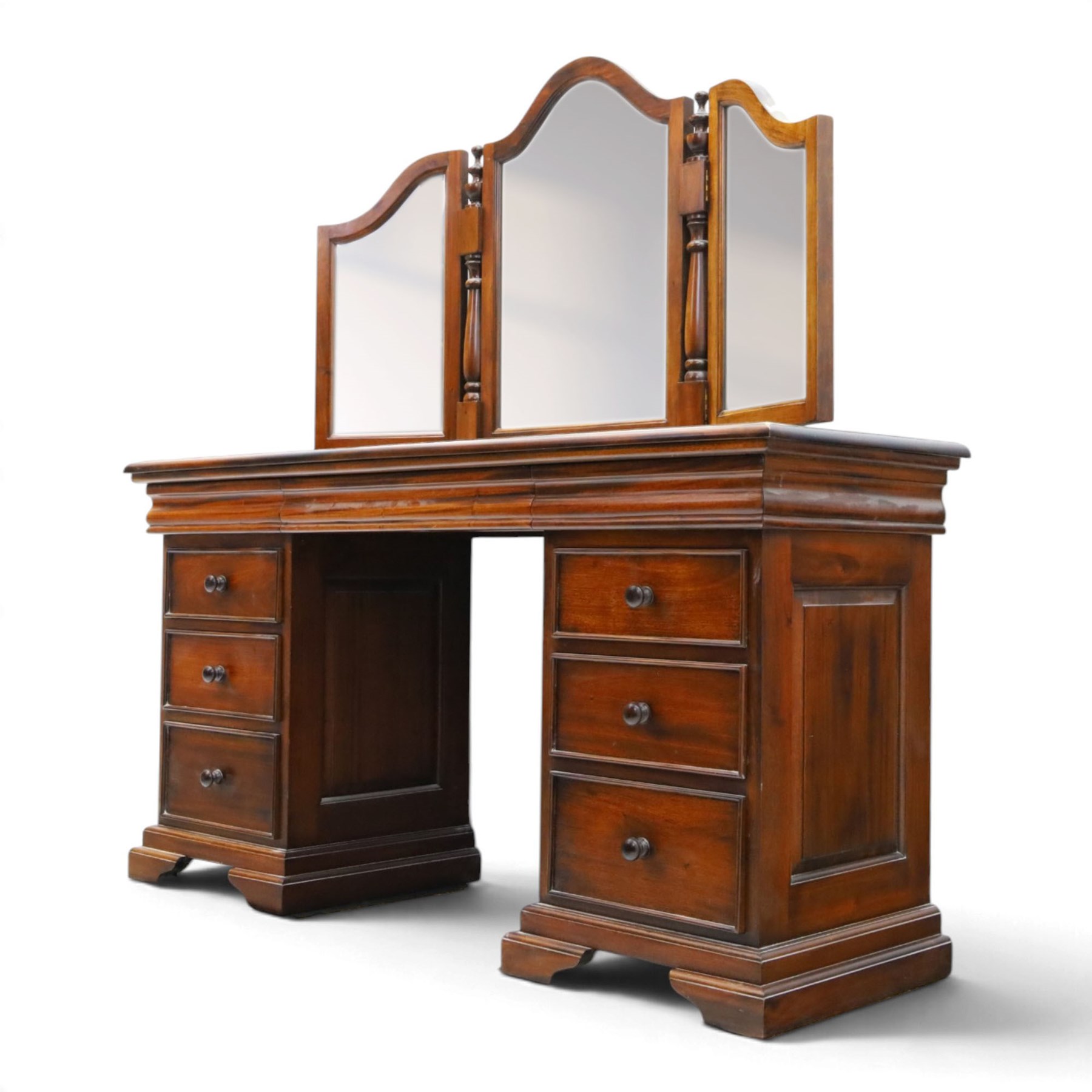 Willis & Gambier - cherrywood dressing table with mirror and stool, three-part mirror on turned uprights with finials, rectangular top above three cushion-moulded frieze drawers, twin pedestals each fitted with three graduated drawers, panelled sides and stepped plinth bases, stool with turned supports and padded seat