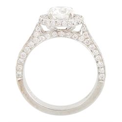 Platinum round brilliant cut diamond cluster ring, the principal diamond of approx 1.05 carat, with diamond surround and shoulders, London 2009, total diamond weight approx 1.65 carat