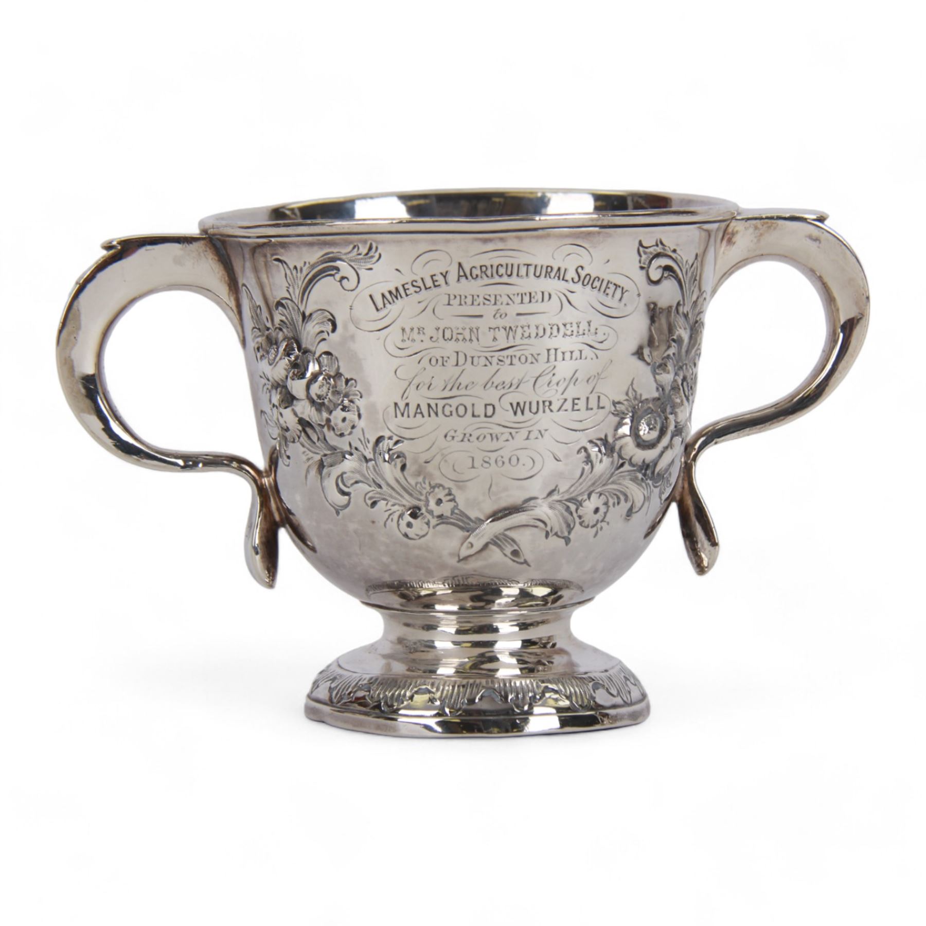 George I silver porringer, of typical form with flat capped twin curved handles,  the body with later presentation engraving surrounded by later embossed foliate decoration, upon a spreading circular foot, hallmarked Sarah Holaday, London 1723, H10.5cm