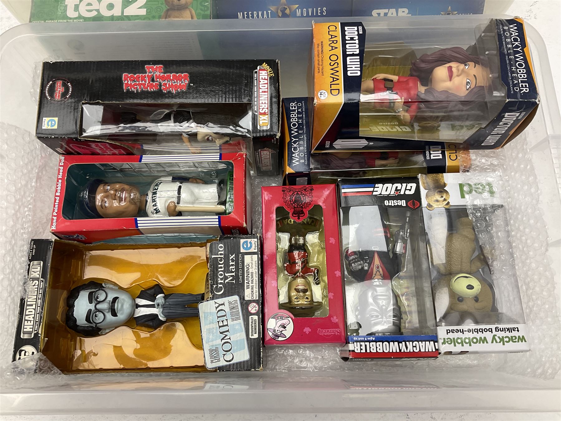 Two Compare the Meerkat meerkat dolls comprising Batman and Star Wars, Ted 2 stuffed doll, quantity of boxed bobble heads, and quantity of magazines with models to include Men At War, Fire Engines of the World etc in three boxes