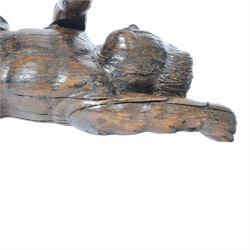 17th century carved figure of a putto, modelled with arms upstretched and head turned, approximately H64cm W23cm D27cm