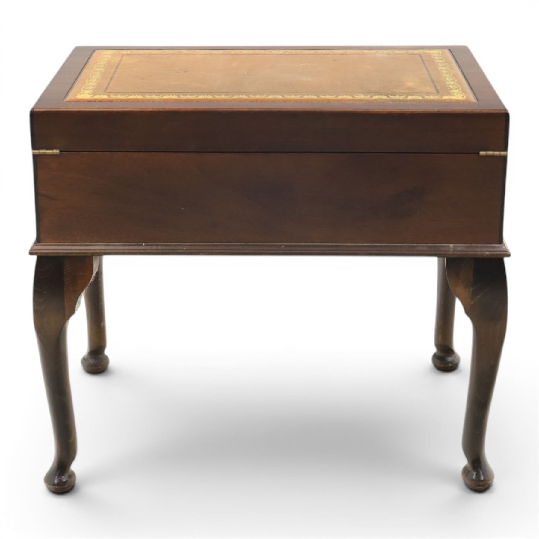 20th century mahogany canteen table, rectangular hinged top inset with gilt tooled leather writing surface, opening to fitted interior containing silver plated cutlery, with lower fitted drawer, on cabriole supports with pad feet