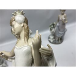 Four Lladro figures, comprising Touch of Class no 5377, Boy Student no 4517, Ocean Beauty no 5785 and Carnival Couple no 4882, largest example H45cm