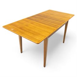 Gordon Russell - mid 20th century teak dining suite, comprising rectangular extending dining table and six matching chairs including one carver, each chair with padded upholstered seat and backrest in vinyl, on square supports, the table with plain top and rounded edges on tapered legs, an example of the firm’s functional post-war design with restrained modernist detailing (Chairs H 85cm, W 47cm, D 46cm) (Extends to 154cm)