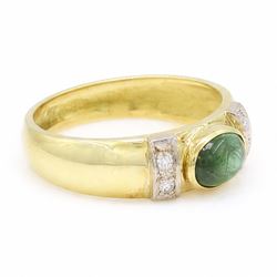 18ct gold tourmaline and diamond ring, bezel set single oval cut tourmaline, with two single cut diamonds set either side, stamped 