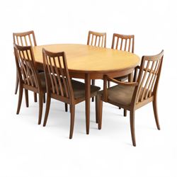 G Plan - mid-20th century teak extending dining table, oval top with integrated extension leaf, raised on tapering legs, together with a set of six slat back dining chairs including two carvers, upholstered in dark green velour (Extends to 210cm)
