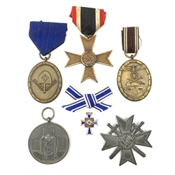 Six WW2 German medals/decorations comprising Red Cross Social Welfare Medal, bronze RAD Long Service award, German Defences Medal, War Merit Cross Second Class, War Merit Cross (Knight's Cross with Swords) and miniature Mother's Cross (6)