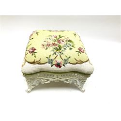 Victorian style cast iron stool, the white painted base of pierced scrolling form, the floral woolwork cushion top, H25cm D34cm