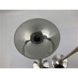 Pair of modern silver candlesticks by Stuart Devlin, the tapering parcel gilt stems with signature textured detailing, each supporting a fluted candle holder and upon a spreading circular foot, hallmarked Stuart Devlin, London 1973, H25cm