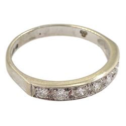 18ct white gold channel set seven stone round brilliant cut diamond half eternity ring, London 1976, total diamond weight approx 0.25 carat
