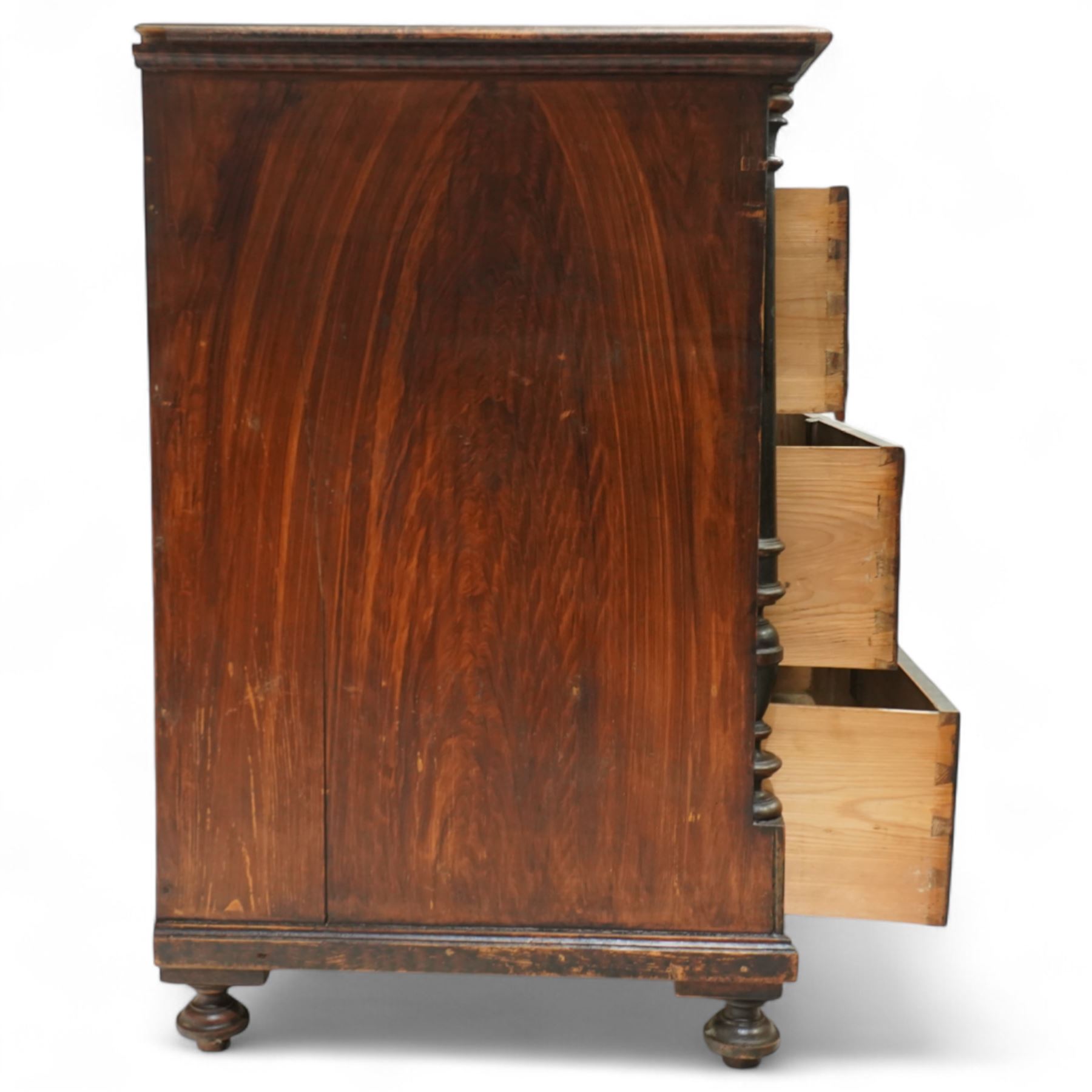 19th century painted pine chest of drawers, the rectangular top with moulded edge and painted floral decoration, above three drawers with later ceramic handles, with half turned column and reeded pilasters, upon turned compressed bun feet  