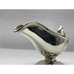 Christofle silver-plated sauce boat, of typical plain form, with capped C scroll handle and engraved anchor crest to body, upon a stepped oval foot, stamped 22 Christofle to base, including handle H14cm