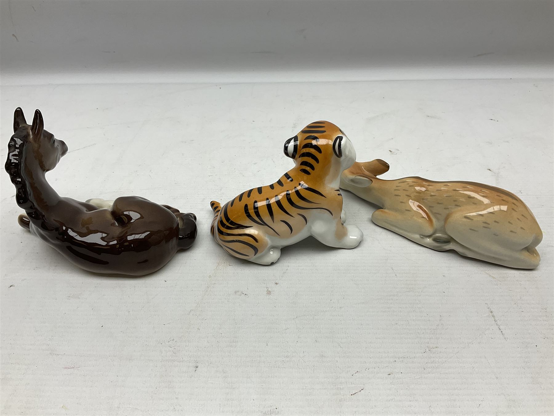 Collection of Russian Lomonosov USSR animal figures, to include  lynx, tiger, red panda, sealion, panada, etc 