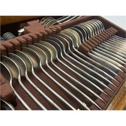 Elkington & Co part canteen of silver plated and stainless steel cutlery, to include simulated ivory handled examples, housed in oak and mahogany case, lock plate stamped 'Acme, British Made', W49cm D31cm H18cm