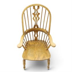 Traditional elm Windsor armchair, hooped spindle back with pierced splat, shaped elm seat, on turned supports united by double H stretcher, turned supports
