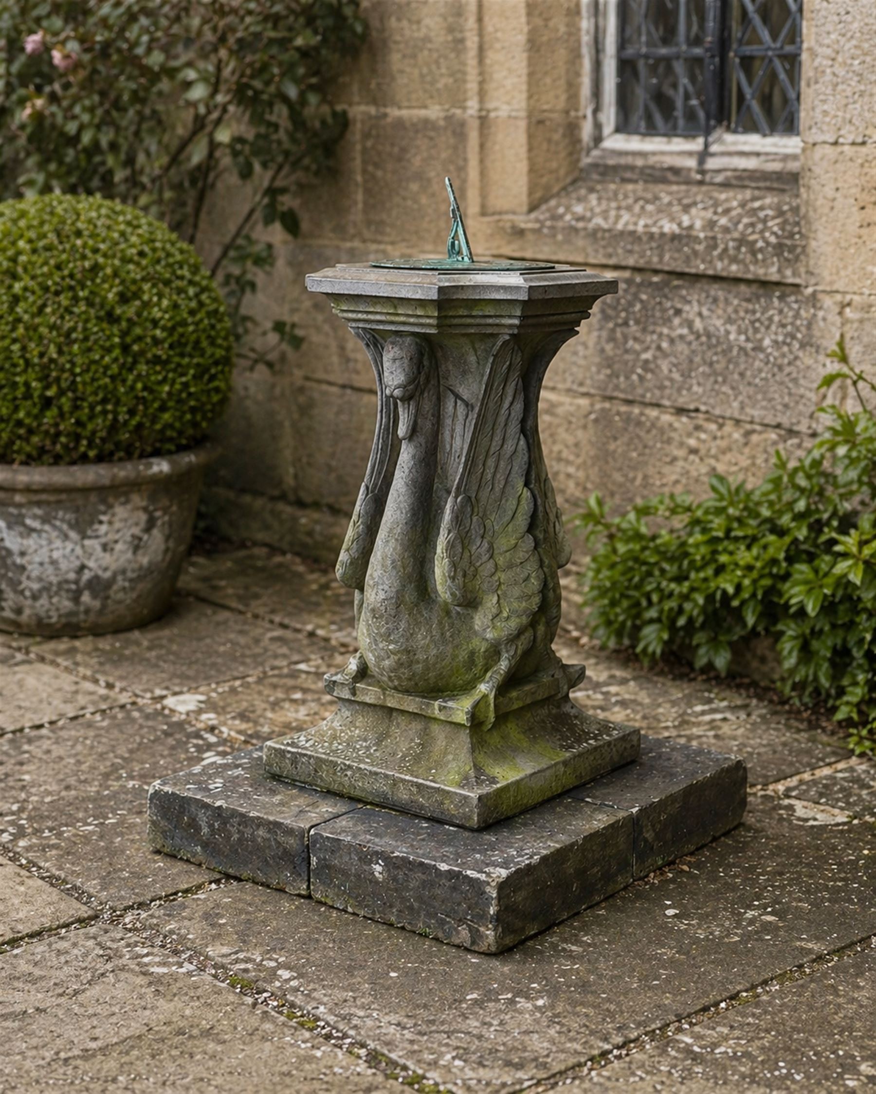Late 20th century terracotta twin swan sundial, well figured seated back to back with shaped top, raised on four sectional base. Measurements exclude base.
Base: 60cm x 60cm