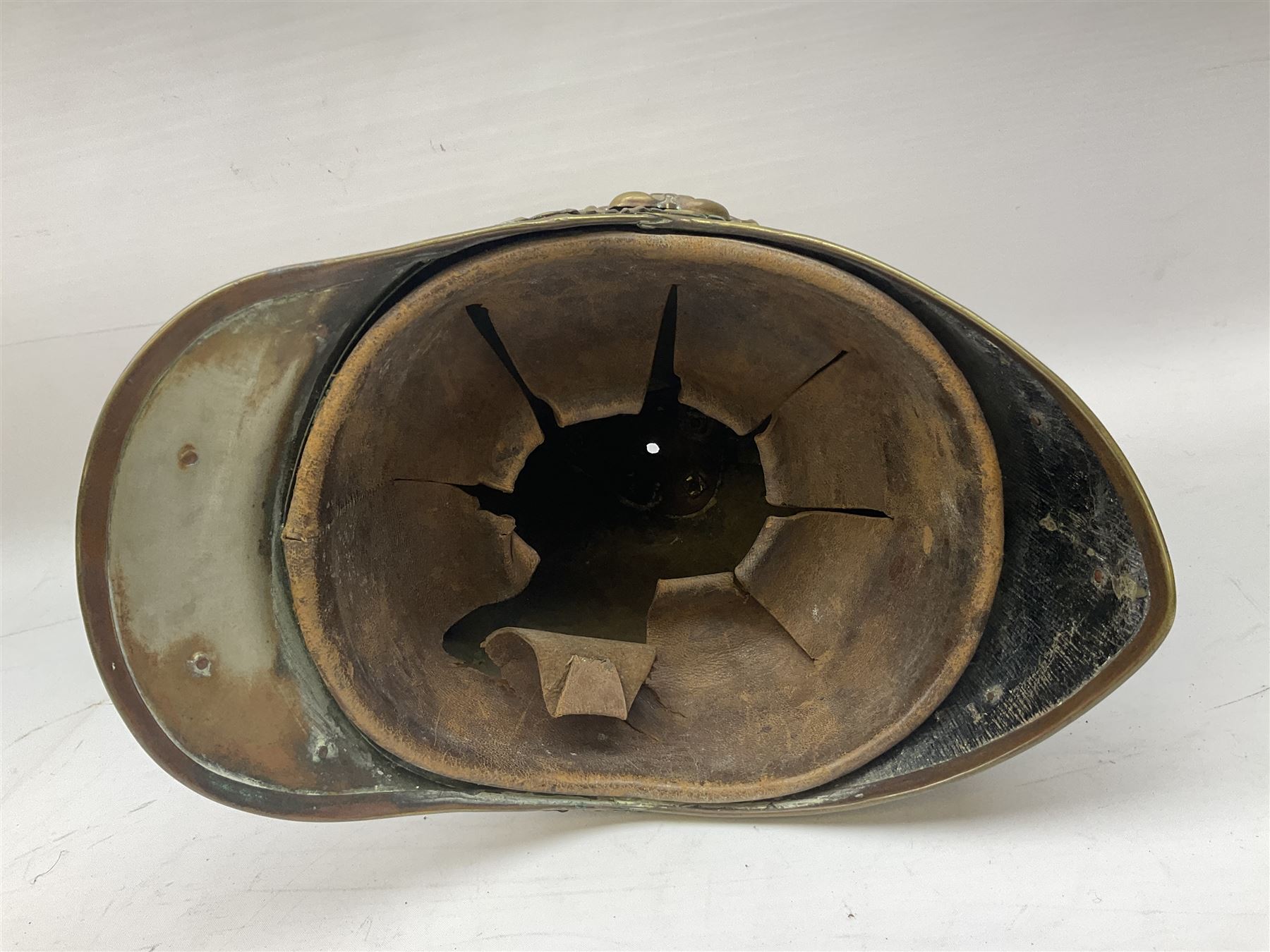 Victorian 1847 Pattern Officer's Helmet of the Inniskilling Dragoons, the white metal skull with gilt fittings including VR cypher to the plate; with leather liner H24cm