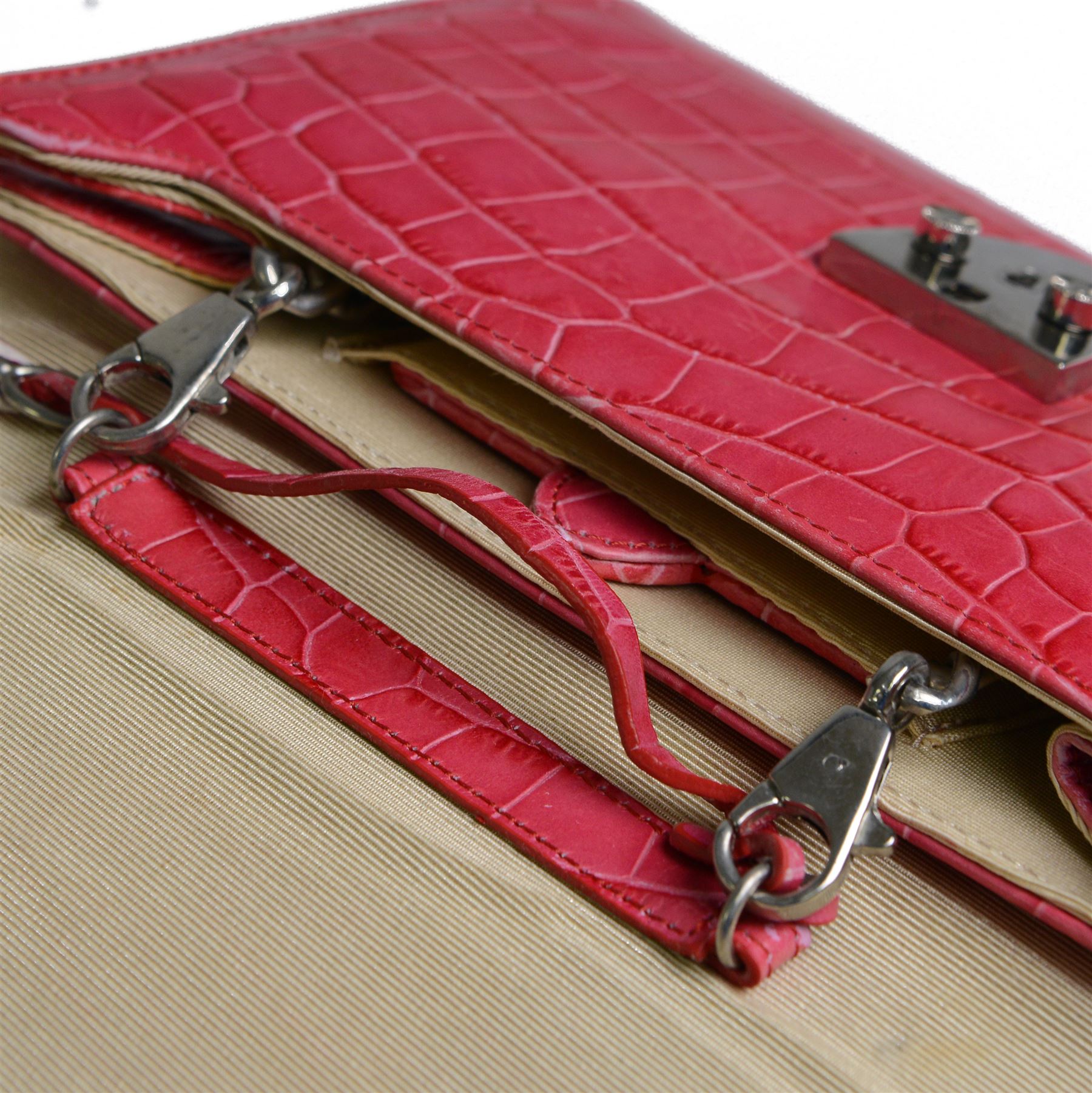 Aspinal of London fuchsia pink crocodile-embossed leather clutch bag with silver-tone shield-shaped clasp engraved Aspinal of London, the flap opening to a beige fabric-lined interior fitted with a zip pocket, slip pocket, integrated mirror and detachable chain shoulder strap, leather brand label stamped Aspinal of London England Fine Leather, accompanied by an Aspinal of London dust bag, W23cm H17cm