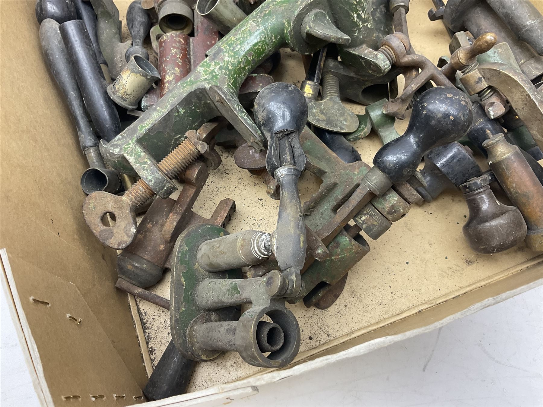 Over twenty items of shotgun cartridge making equipment including eight roll turnover tools, four re/decapping tools, six powder measures etc