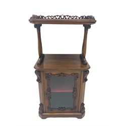 19th century rosewood etagere side cabinet, the upper tier with pierced gallery on two shaped and moulded supports with scroll carved decoration, the main body fitted with cabinet enclosed by glazed door, the door with shaped and carved slip, canted uprights with scroll carved corbels and brackets, on bracket skirt base