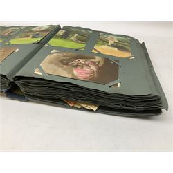 Album containing over two-hundred Edwardian and later postcards including twenty-two WW1 embroidered silks, other WW1 cards, comic, greetings, Bamforth song cards, set of seven Maurice Milliere Theatreuses and other glamour cards, real photographic topographical, groups etc