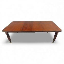 Large Victorian mahogany dining table, rectangular telescopic top with two additional leaves, upon turned knopped and reeded legs with ceramic casters, (Extends to 230cm)