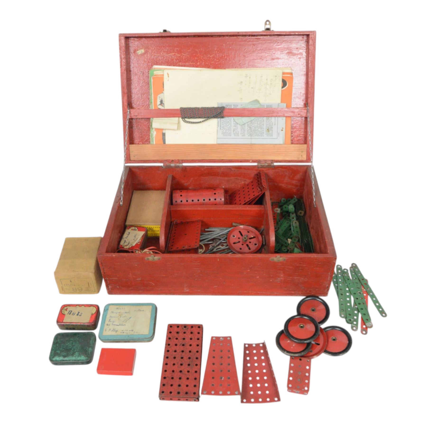 Mid 20th century Meccano outfit, including perforated strips, wheels, angled plate, boiler, flanged plates, no. 1 clockwork motor, etc, contained within red wooden box, with hand painted lettering to the cover reading 'No.7 Meccano B.H'