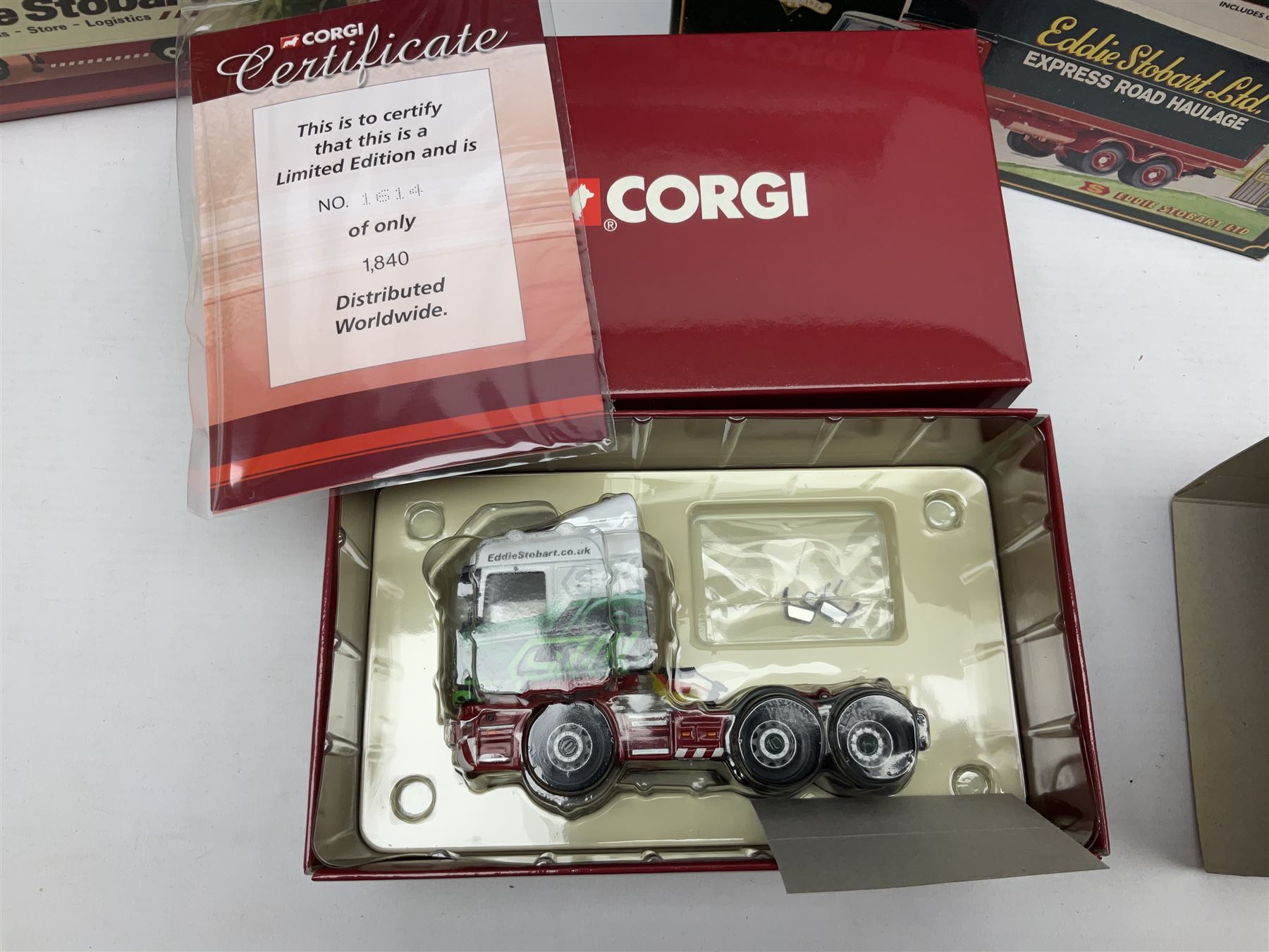 Corgi Eddie Stobart - four Classics lorries; 18801 Bedford KM, 97369 AEC Truck & Trailer, 23101 Ford Transcontinental Tilt Trailer and 14303 Foden S21 Artic Trailer; limited edition 21601 AEC Ergomatic 6-wheel Tipper; and two others in the Roadscene and Truckfest 25 Series; all boxed (7)
