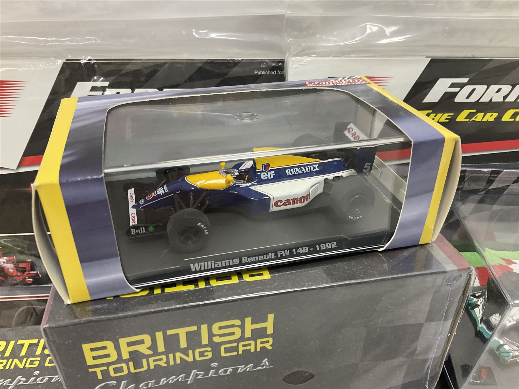 Panini Formula 1 The Car Collection - twelve blister packed racing cars and quantity of periodicals; nine mostly unopened Atlas Editions British Touring Car Champions; and six other boxed/blister packed die-cast models of racing cars
